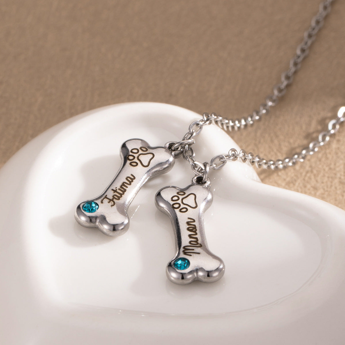 ART FUREVER custom pet jewelry - personalized engraved silver bone shaped necklace - pet name charm and minimalistic design